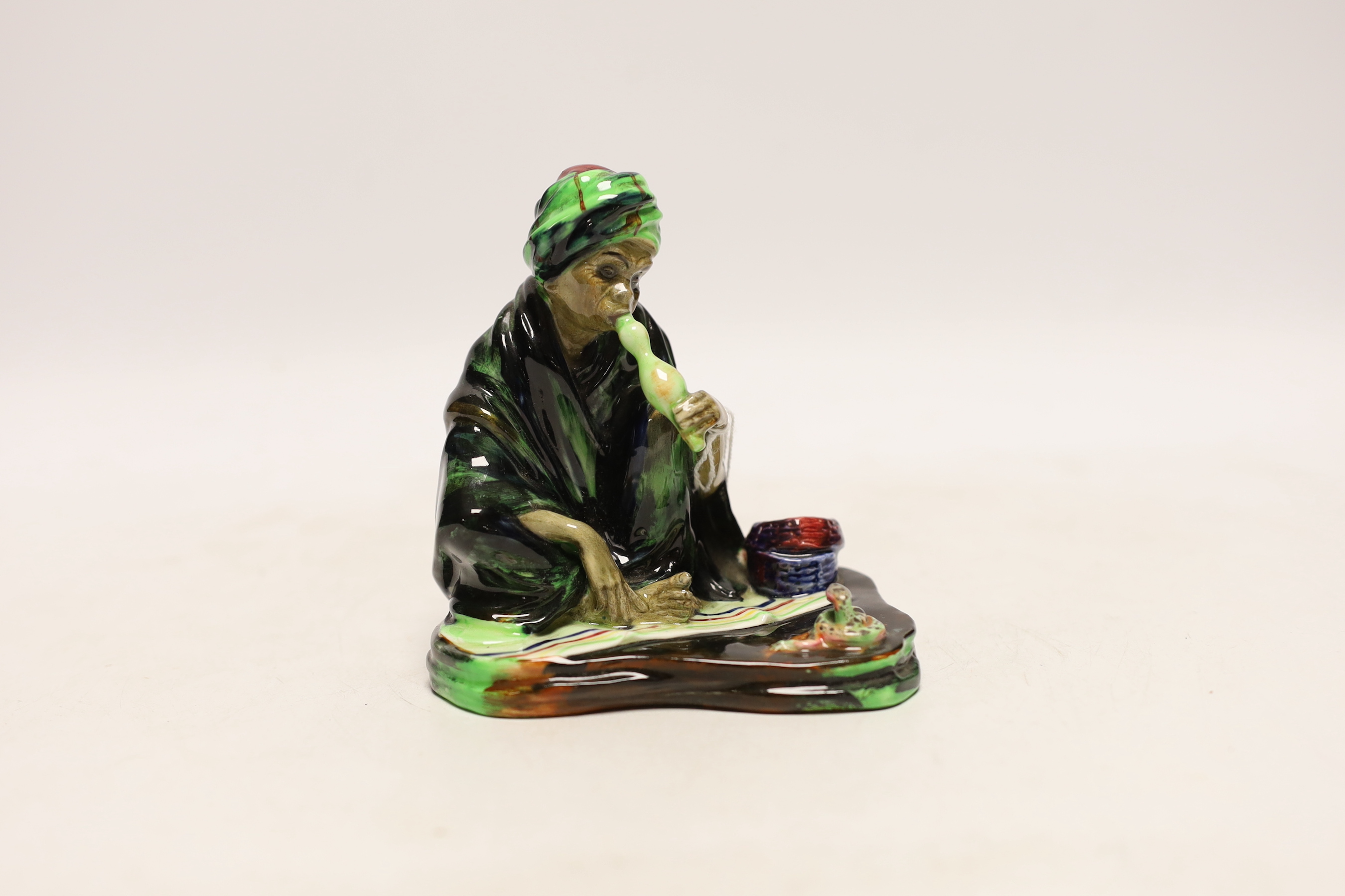 A Royal Doulton figure of The Snake Charmer HN1317, signed EL, 11.5cm
